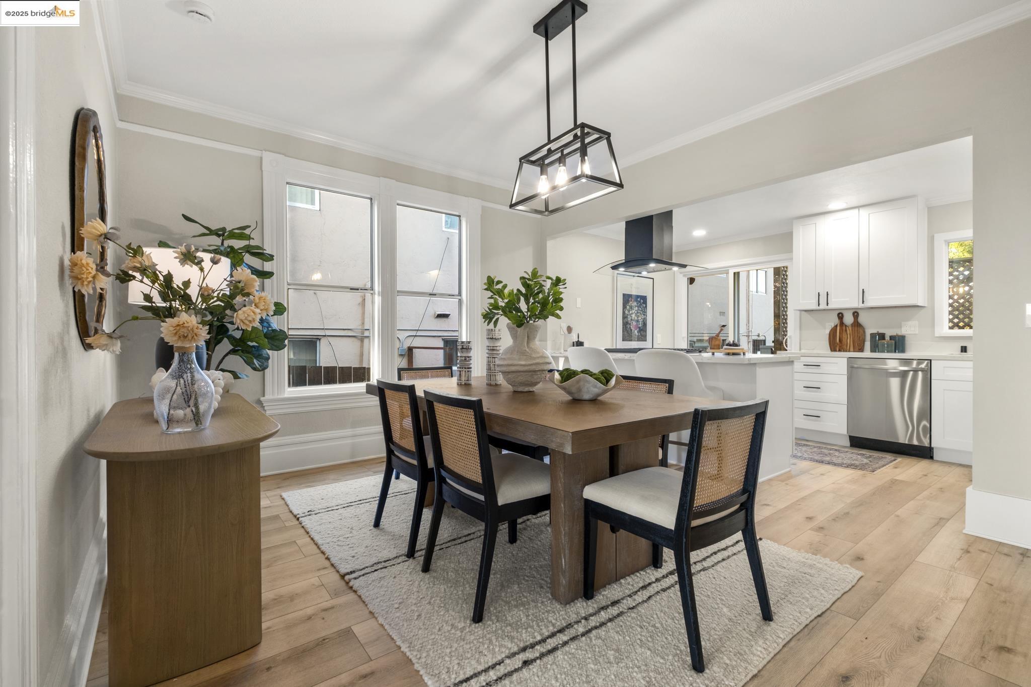 2050 East 30th Street Oakland, CA 94606 - Photo 10 of 48 Dining room featuring light wood finished floors and crown molding
