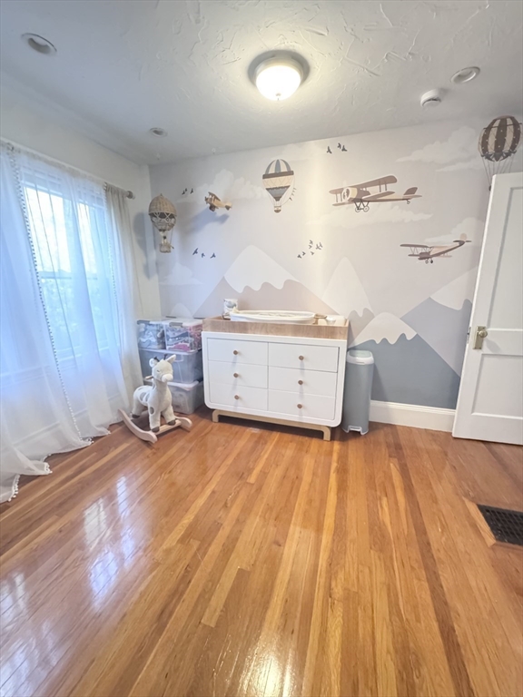 27 Park Saugus Ma Saugus, MA 01906 - Photo 21 of 32 a view of a room with window and wooden floor