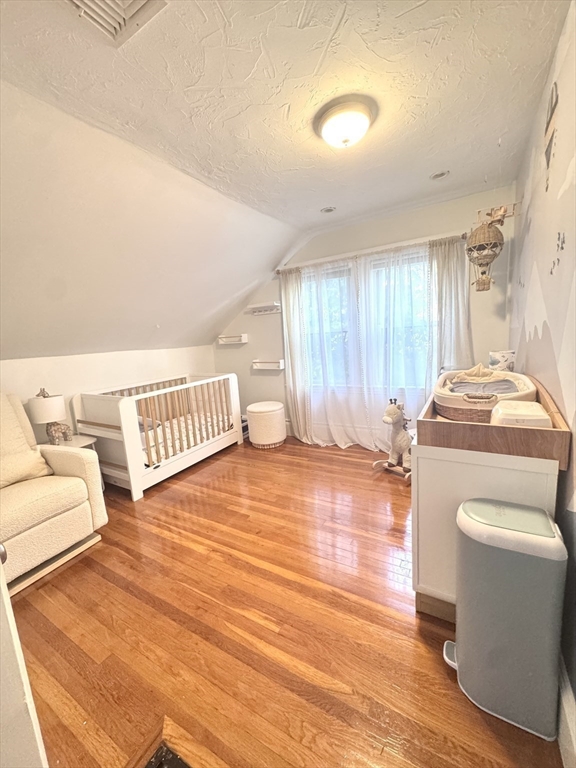 27 Park Saugus Ma Saugus, MA 01906 - Photo 23 of 32 a living room with a rug and a wooden floor