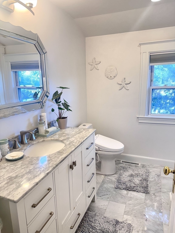 27 Park Saugus Ma Saugus, MA 01906 - Photo 25 of 32 a bathroom with a granite countertop toilet sink and mirror