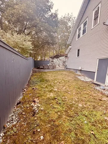 a view of a patio with table and chairs with wooden floor