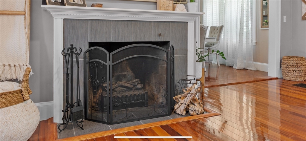 27 Park Saugus Ma Saugus, MA 01906 - Photo 6 of 32 a living room with a fireplace