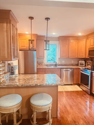 a kitchen with a sink cabinets and window