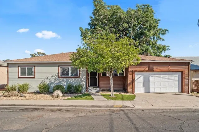 front view of a house with a yard