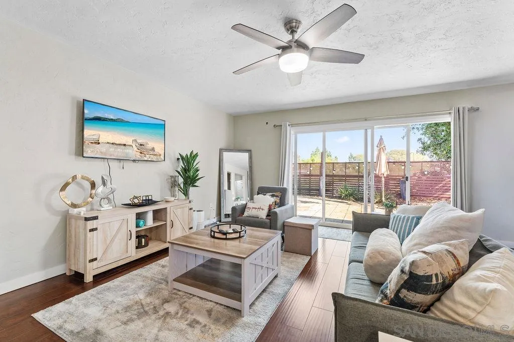 5109 Alumni Place San Diego, CA 92115 - Photo 3 of 7 a living room with furniture and a large window
