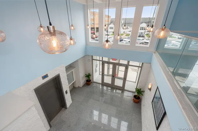 a view of an entryway and wooden floor