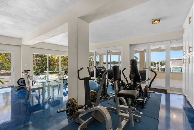 a view of a lake with a table and chairs