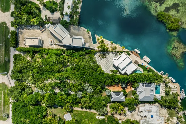 a front view of a house with large windows