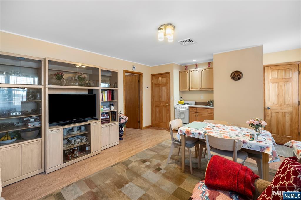 66 Roehrs Drive Wallington, NJ 07057 - Photo 26 of 37 a living room with furniture and a flat screen tv