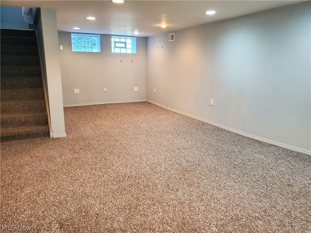 4024 Buxton Road Cleveland, OH 44121 - Photo 16 of 25 Finished recreation room is brightly lit and adds extra living space for a family room or play room.