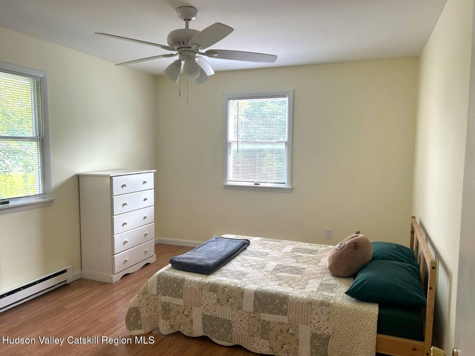 375 North Lake Road Haines Falls, NY 12436 - Photo 11 of 25 a bedroom with a bed and a window