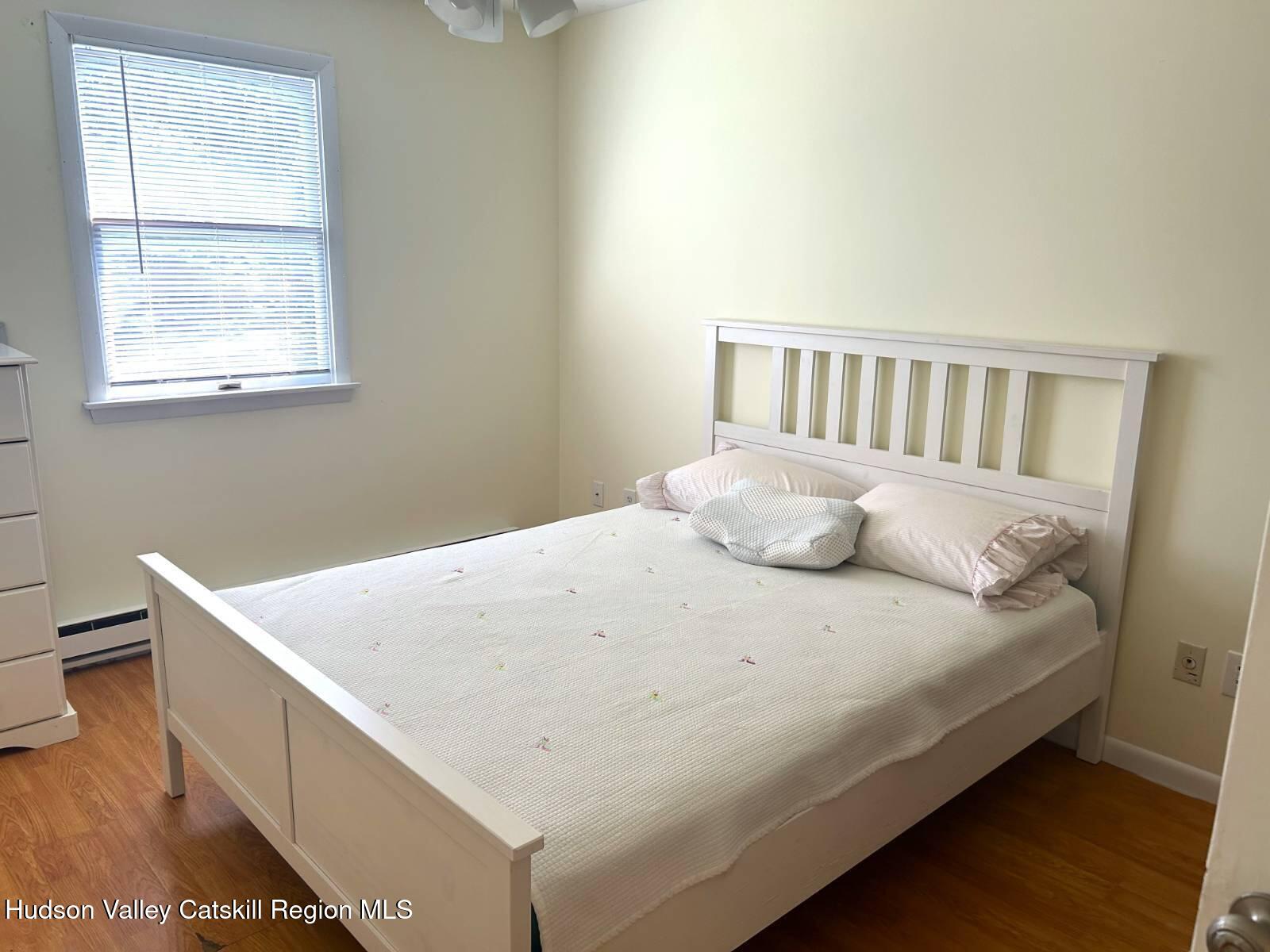 375 North Lake Road Haines Falls, NY 12436 - Photo 13 of 25 a large bed sitting in a bedroom next to a window