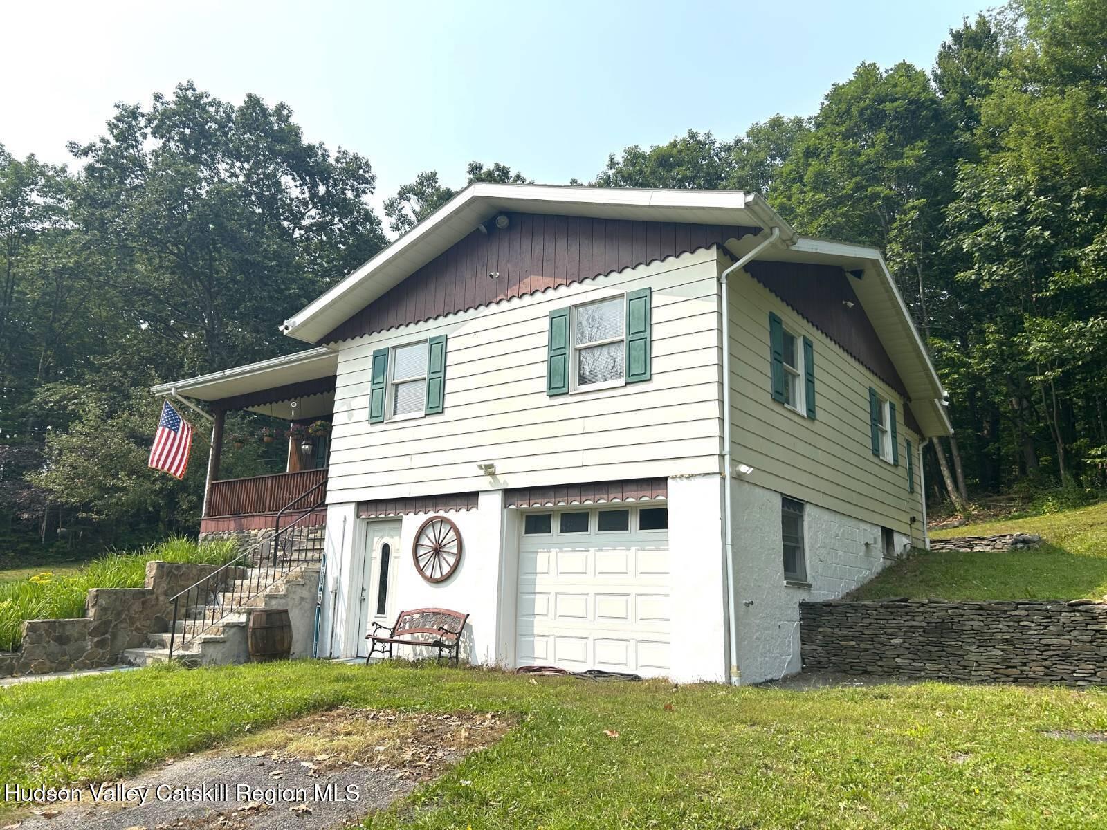 375 North Lake Road Haines Falls, NY 12436 - Photo 4 of 25 a front view of a house with a yard