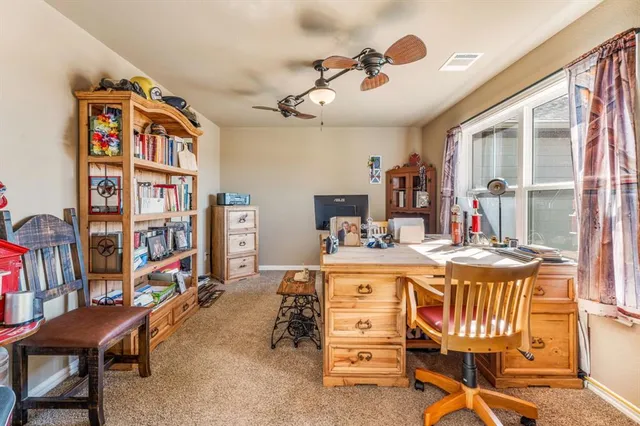 a view of a workspace with furniture