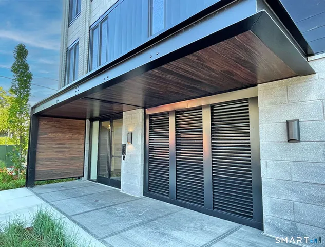 a view of balcony with wooden floor and fence