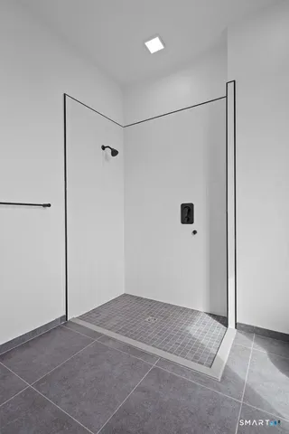 a view of tall building sitting on the side of a street