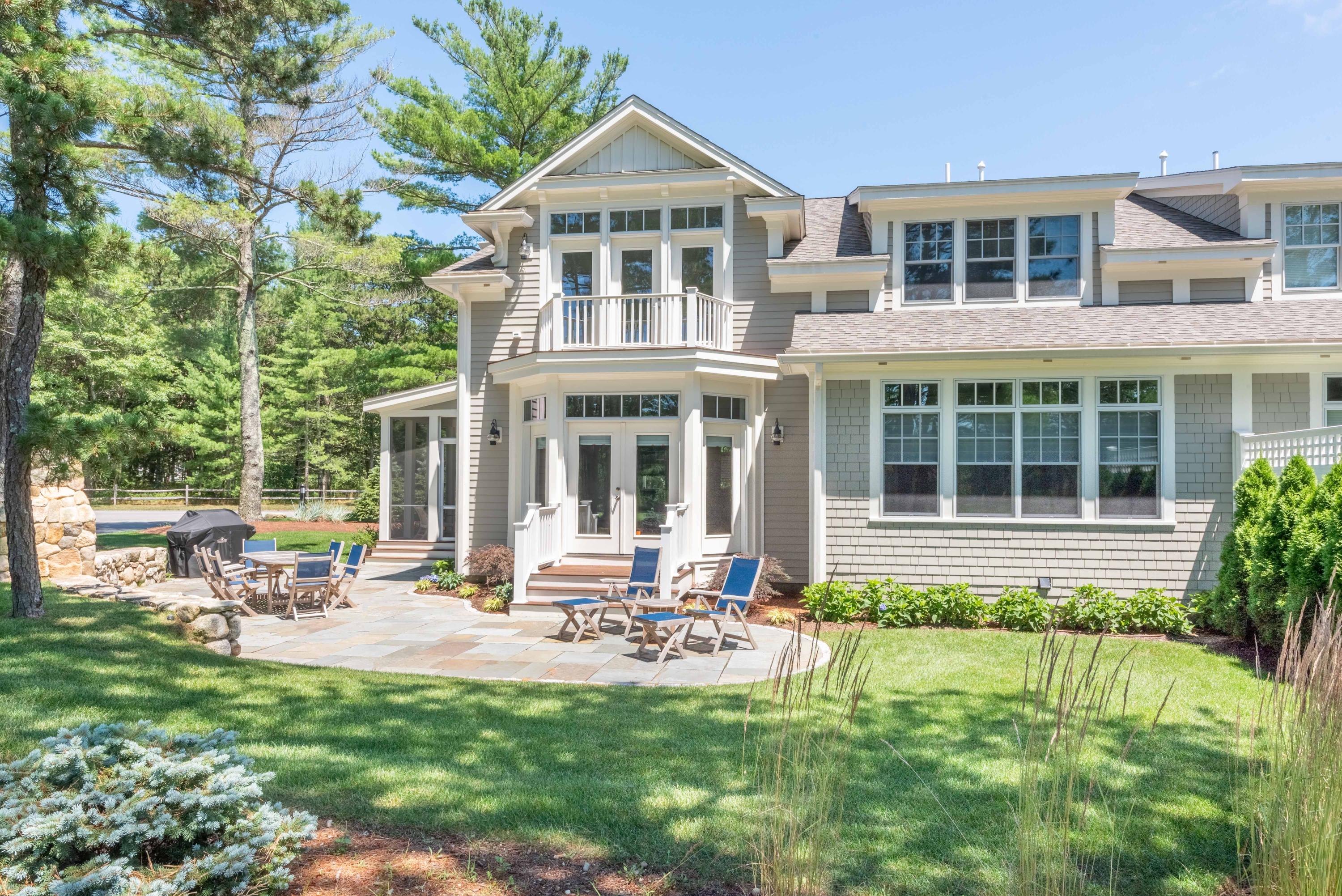 24 Simons Road, Unit B Mashpee, MA 02649 - Photo 1 of 14 a front view of a house with a yard