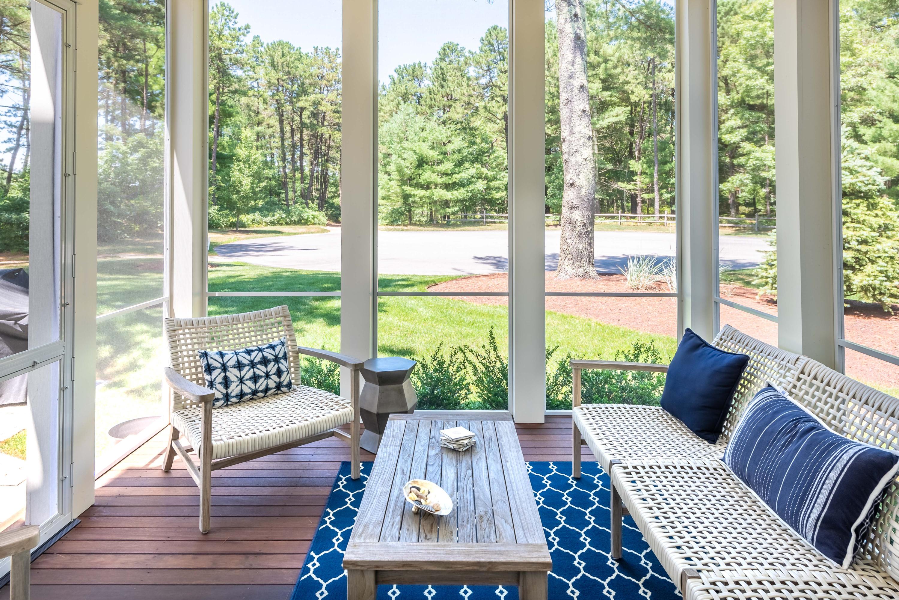 24 Simons Road, Unit B Mashpee, MA 02649 - Photo 7 of 14 a living room with large windows and wooden floor