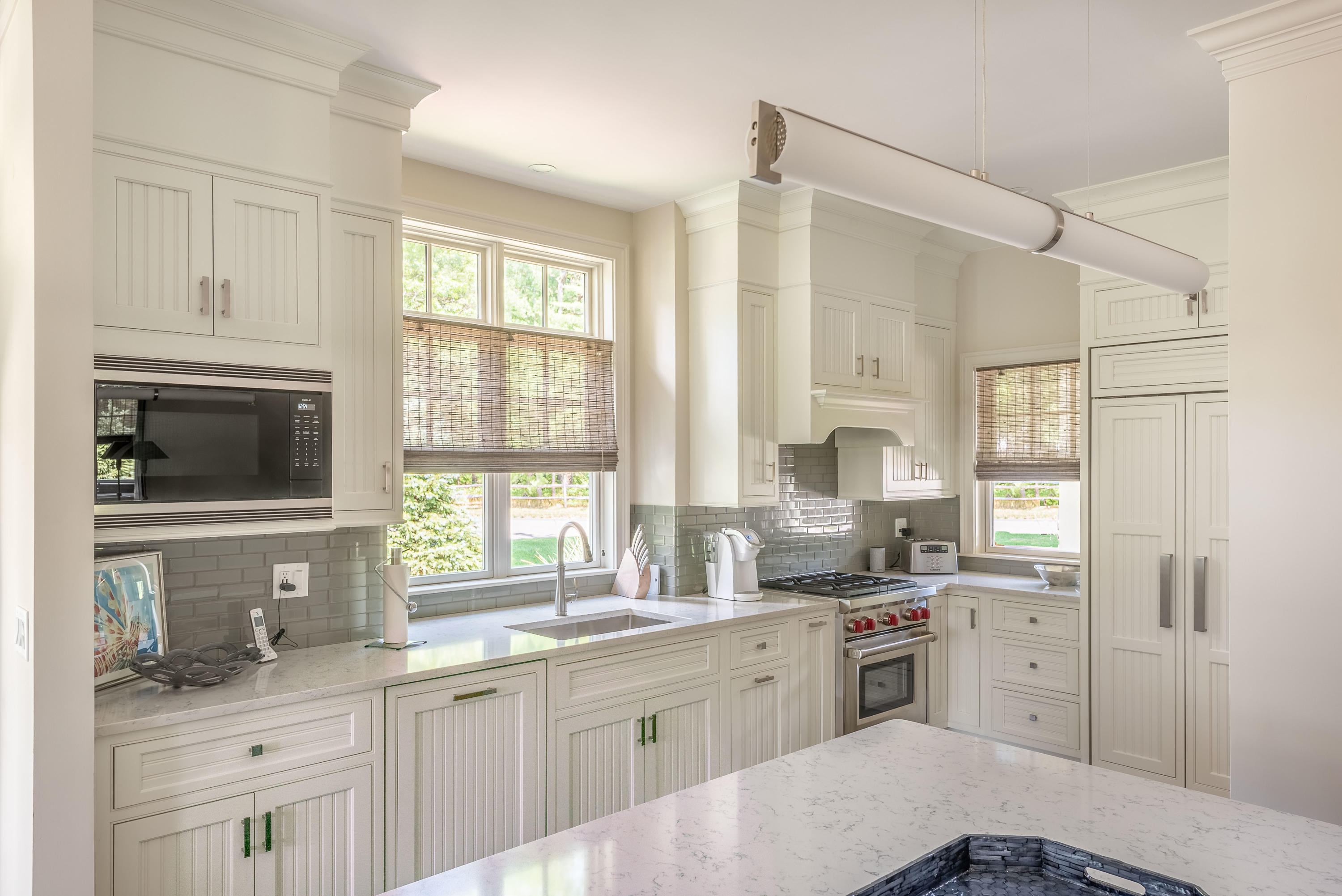 24 Simons Road, Unit B Mashpee, MA 02649 - Photo 8 of 14 a kitchen with a sink stove and refrigerator