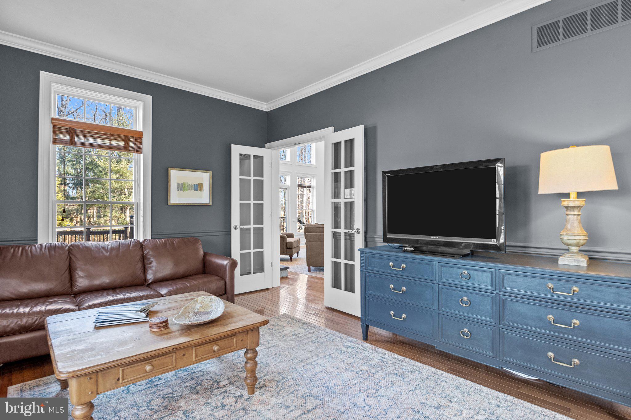 3216 Aquetong Road Doylestown, PA 18902 - Photo 20 of 54 a living room with furniture and a flat screen tv