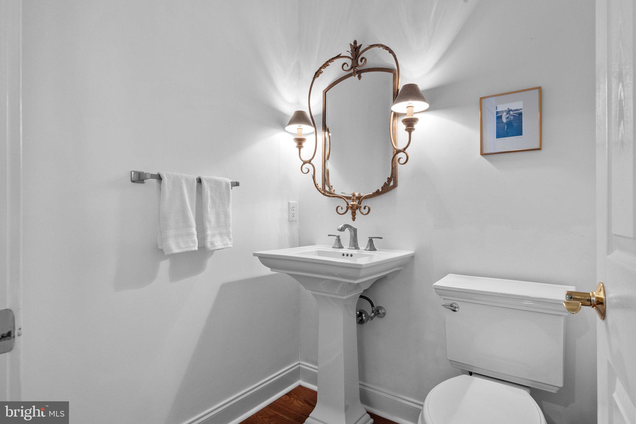 3216 Aquetong Road Doylestown, PA 18902 - Photo 21 of 54 a bathroom with a toilet sink and mirror