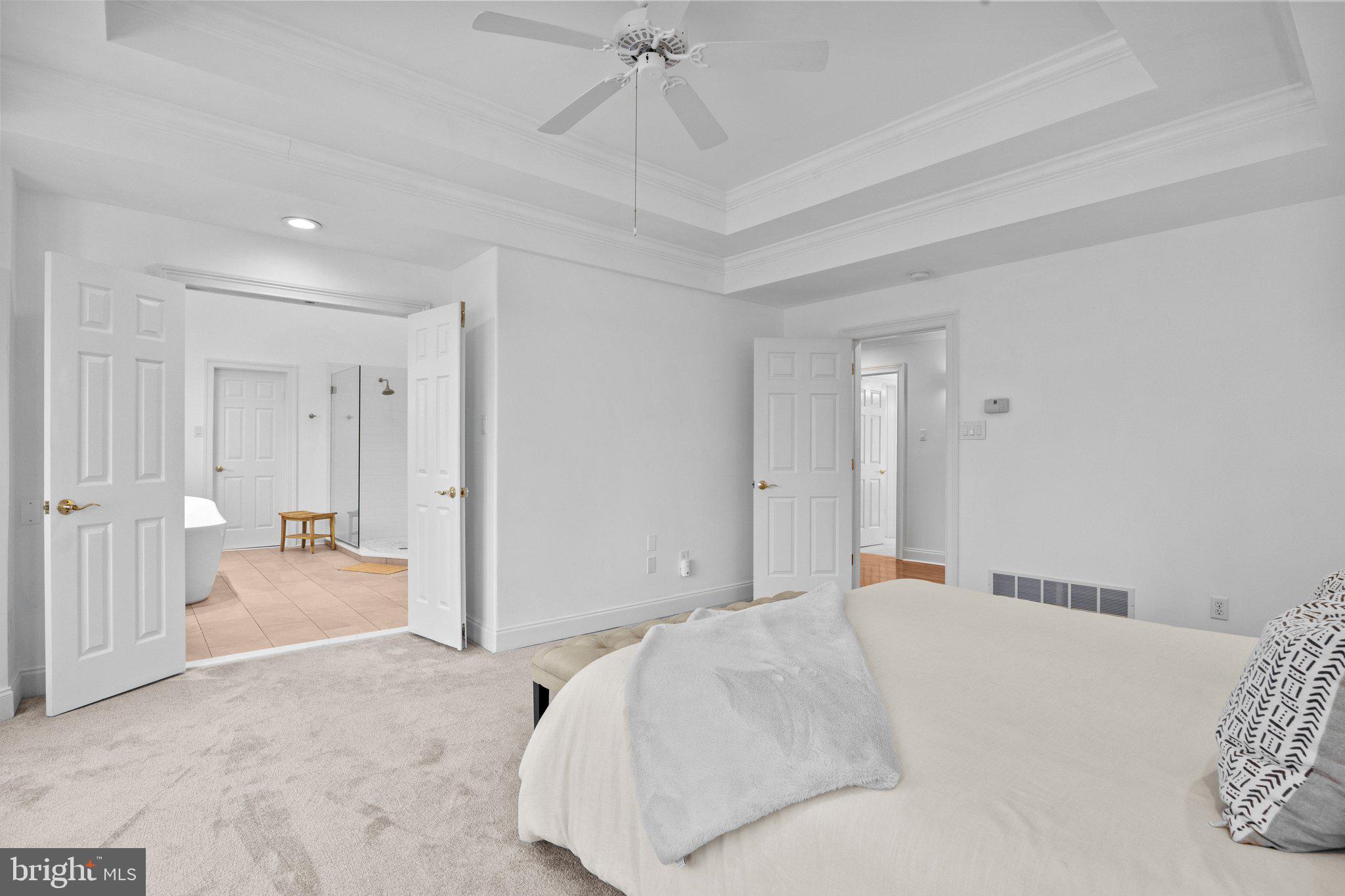 3216 Aquetong Road Doylestown, PA 18902 - Photo 26 of 54 a bedroom with a bed and a chandelier