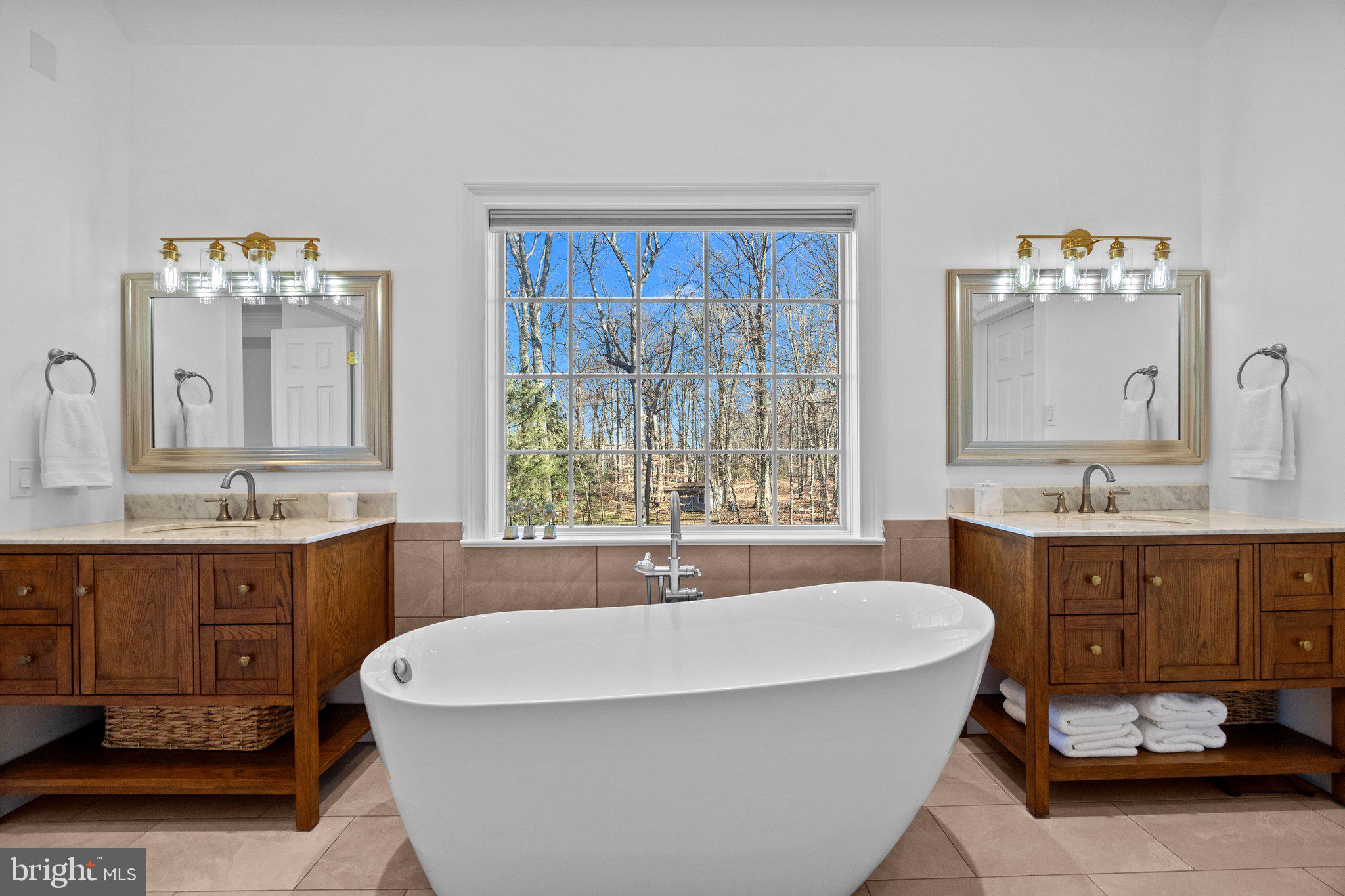 3216 Aquetong Road Doylestown, PA 18902 - Photo 28 of 54 a spacious bathroom with a tub sink and mirror