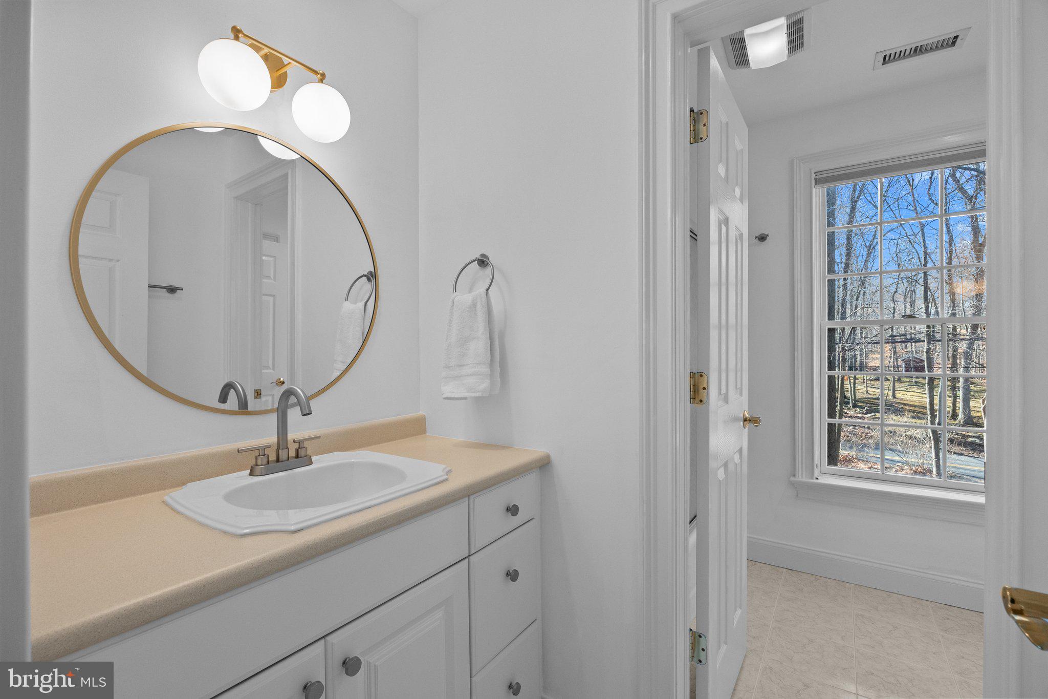 3216 Aquetong Road Doylestown, PA 18902 - Photo 34 of 54 a bathroom with a sink a vanity and a mirror