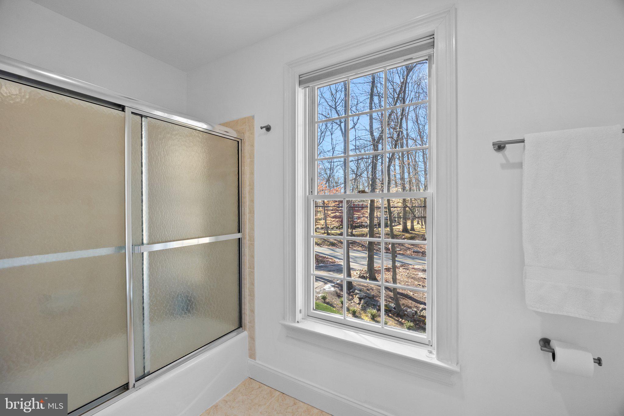 3216 Aquetong Road Doylestown, PA 18902 - Photo 35 of 54 a bathroom with a glass shower door