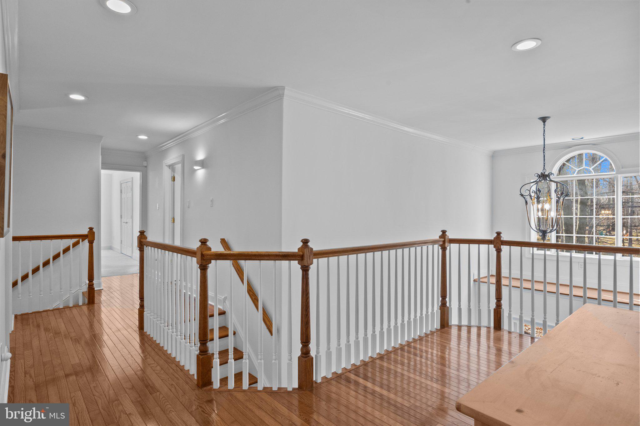 3216 Aquetong Road Doylestown, PA 18902 - Photo 38 of 54 a view of a hallway with wooden floor and stairs