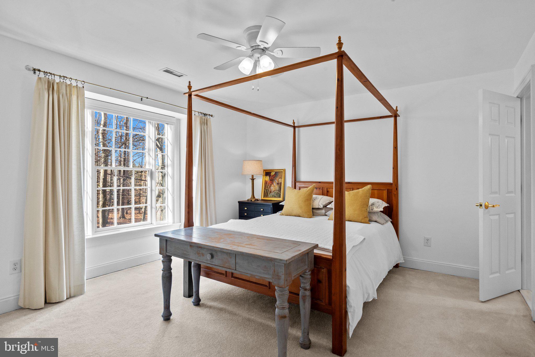 3216 Aquetong Road Doylestown, PA 18902 - Photo 40 of 54 a bedroom with a bed and a table lamp