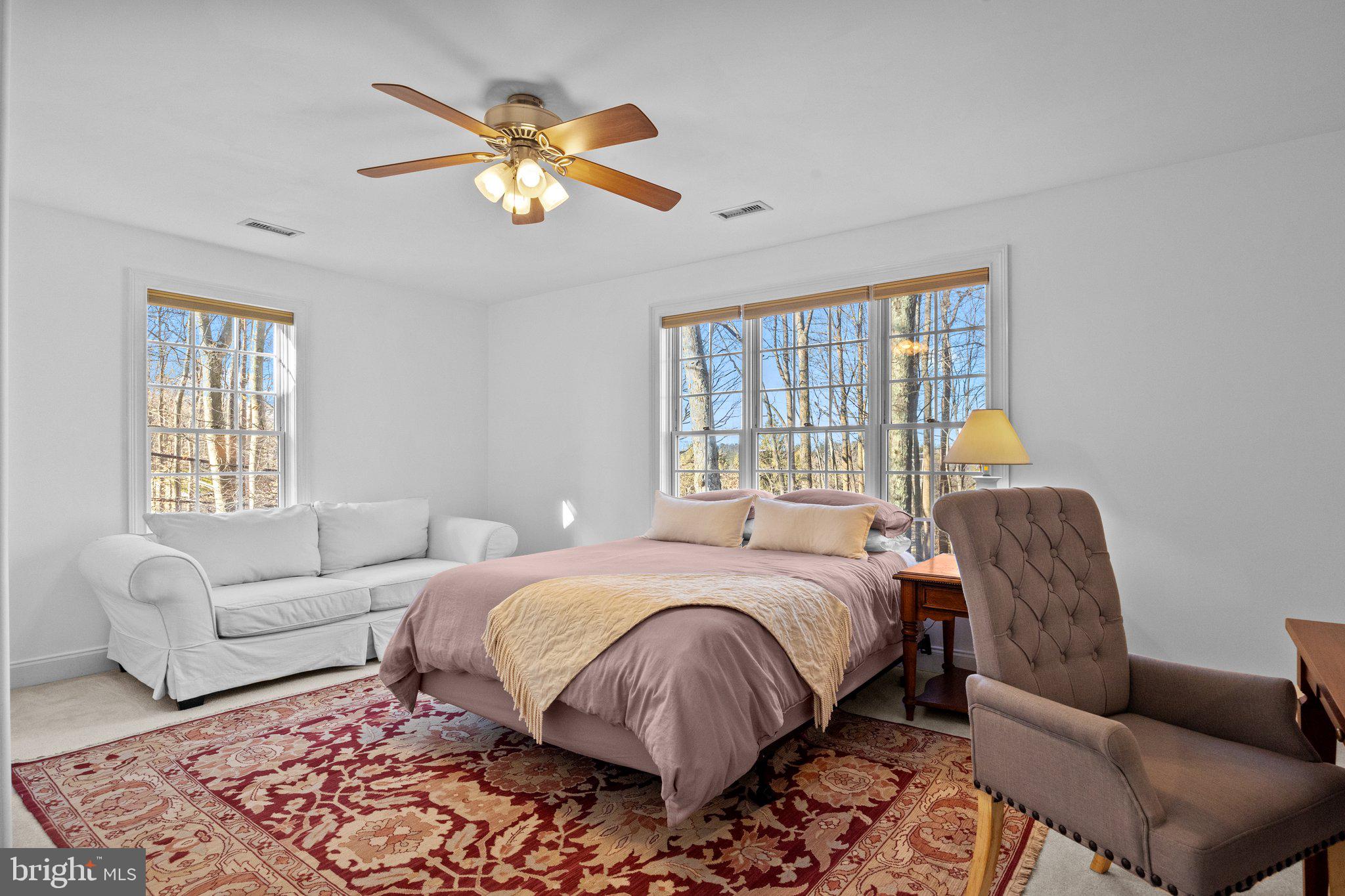 3216 Aquetong Road Doylestown, PA 18902 - Photo 42 of 54 a bedroom with a bed couches and a couch