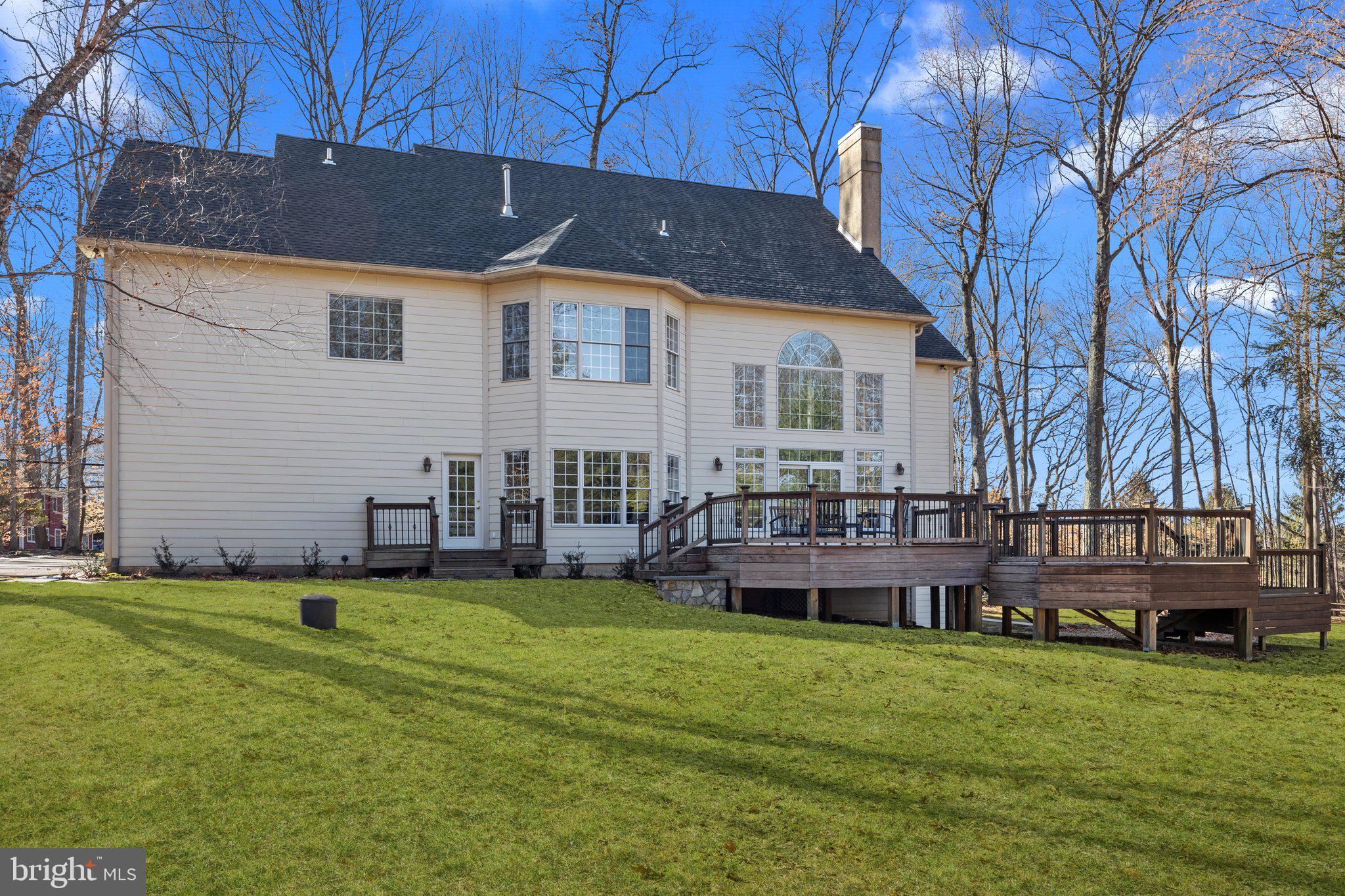 3216 Aquetong Road Doylestown, PA 18902 - Photo 50 of 54 a backyard of a house with yard and seating space