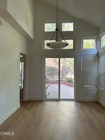 an empty room with windows and mountain view