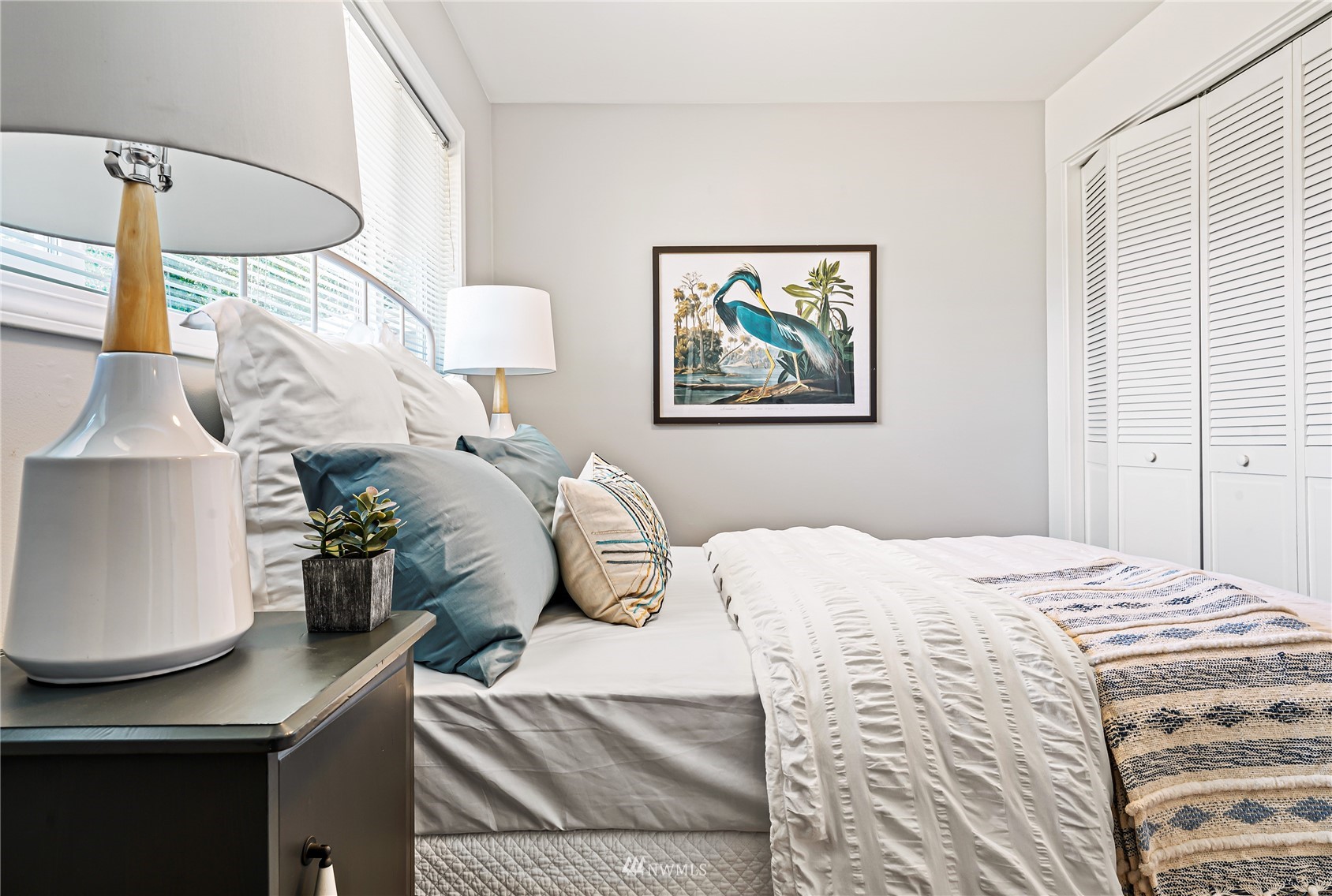 3908 Northeast 22nd Street Renton, WA 98056 - Photo 23 of 32 a bedroom with a bed and a painting on the wall