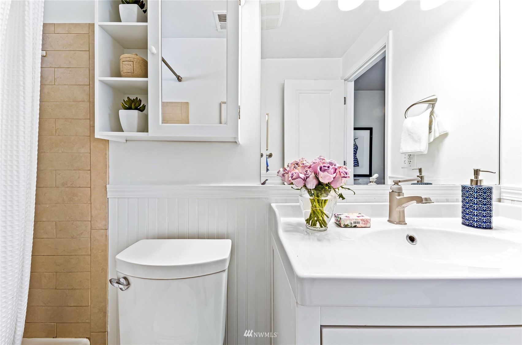 3908 Northeast 22nd Street Renton, WA 98056 - Photo 26 of 32 a bathroom with a sink a toilet and mirror