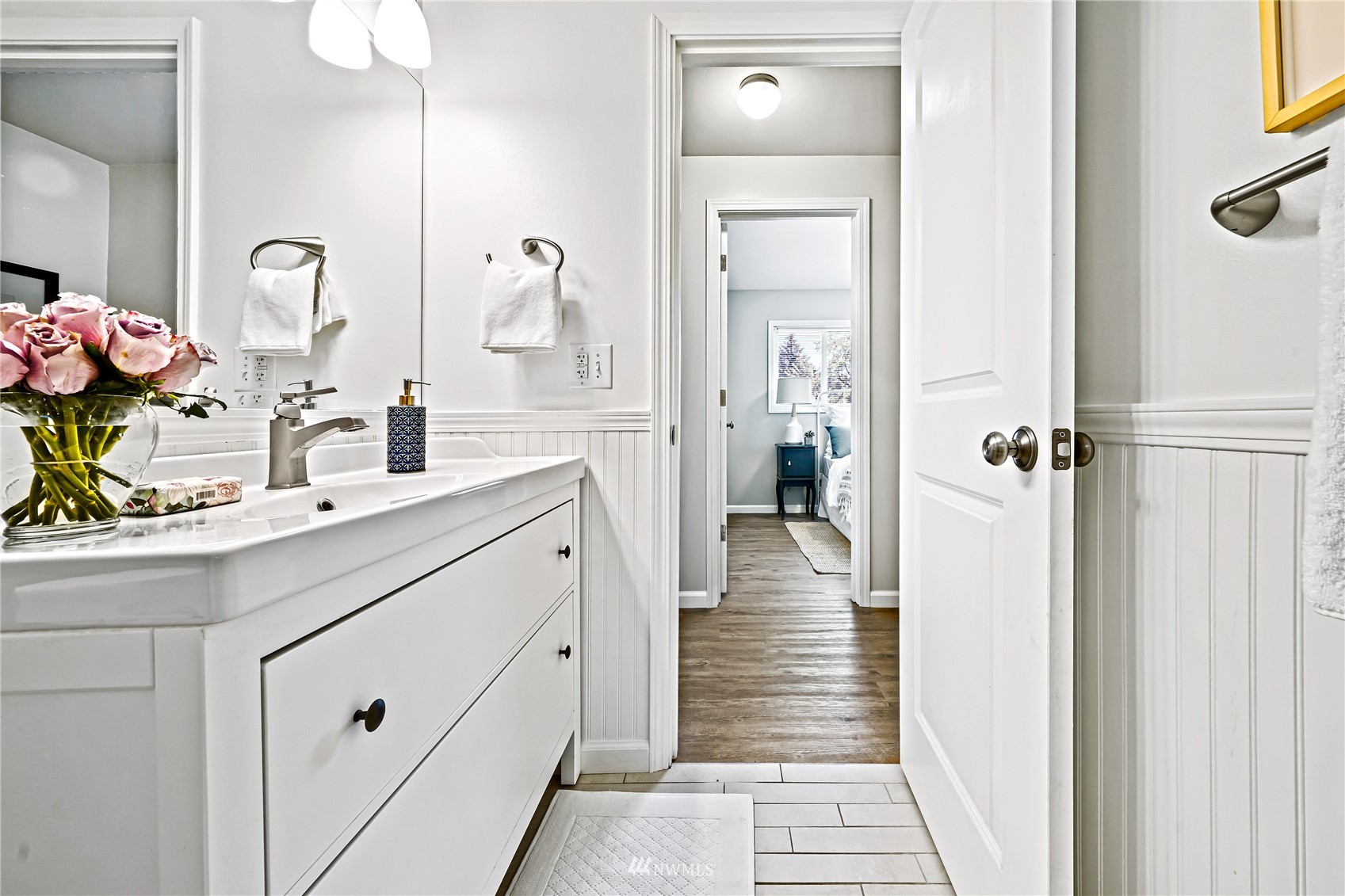 3908 Northeast 22nd Street Renton, WA 98056 - Photo 27 of 32 a bathroom with a sink and mirror with shower