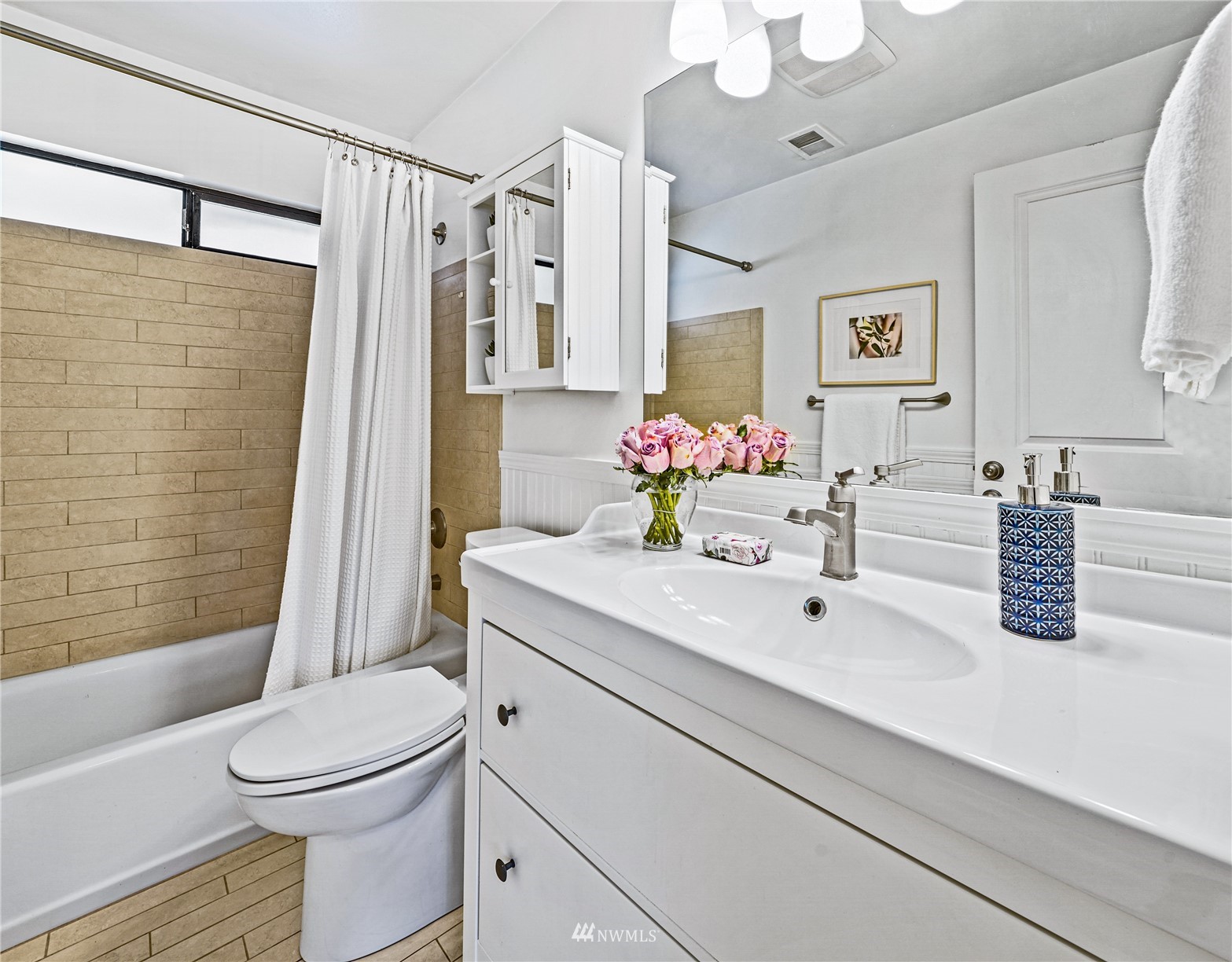 3908 Northeast 22nd Street Renton, WA 98056 - Photo 28 of 32 a bathroom with a sink a toilet and shower