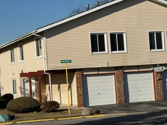 a view of a house with a street