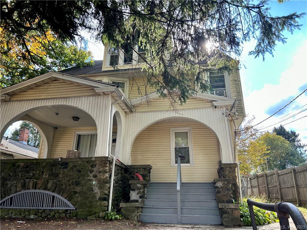 210 Meriden Road Waterbury, CT 06705 - Photo 1 of 1 a front view of a house with garden