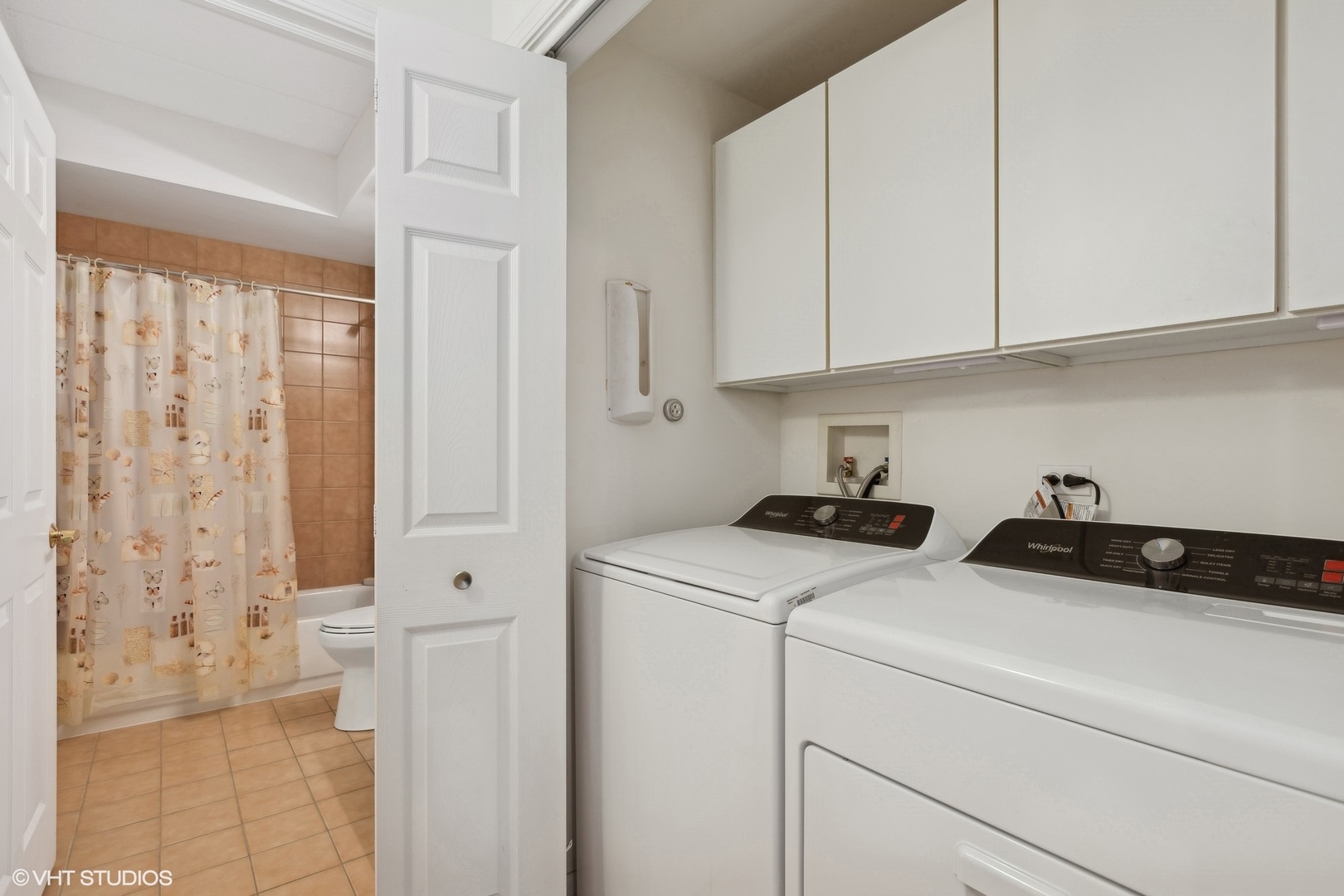 1479 North Milwaukee Avenue, Unit 205 Libertyville, IL 60048 - Photo 7 of 10 a view of storage and utility room with closet dryer