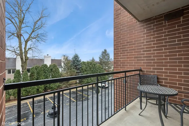 a view of a chair and table in the balcony