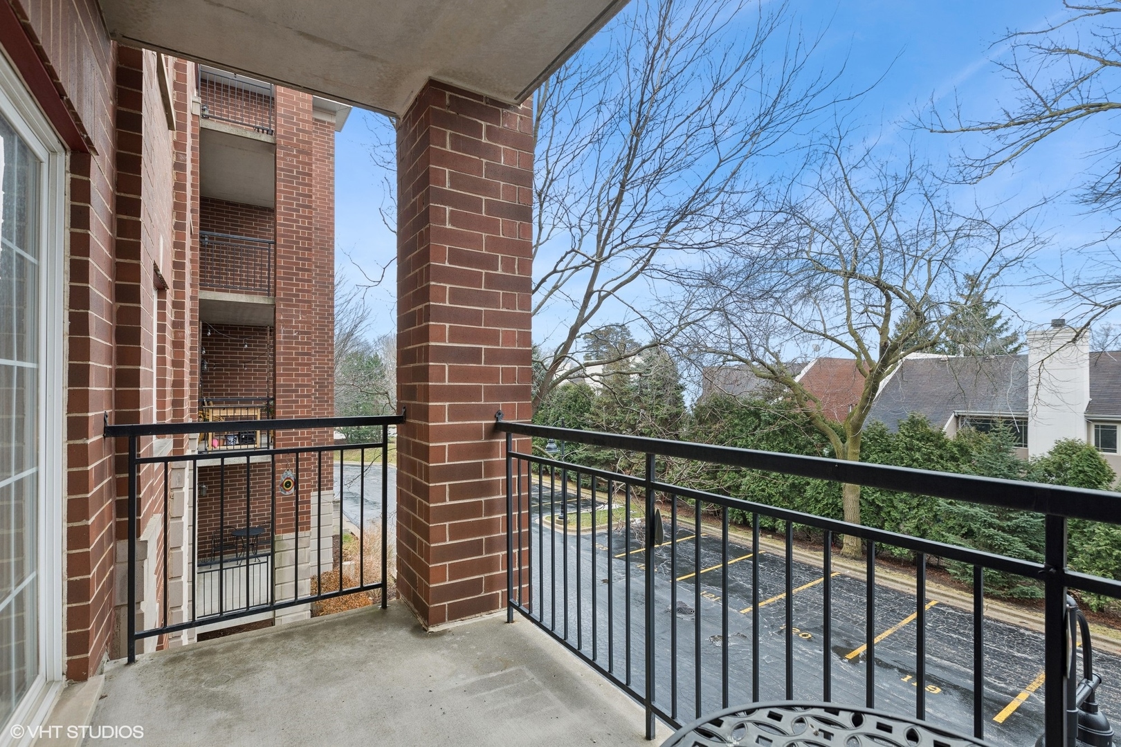 1479 North Milwaukee Avenue, Unit 205 Libertyville, IL 60048 - Photo 9 of 10 a view of a balcony with a pot