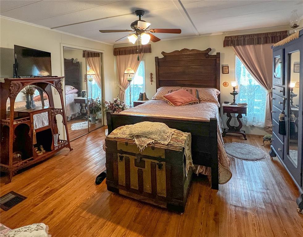 34543 Rosebud Row Zephyrhills, FL 33541 - Photo 18 of 41 a view of a livingroom with furniture window and wooden floor