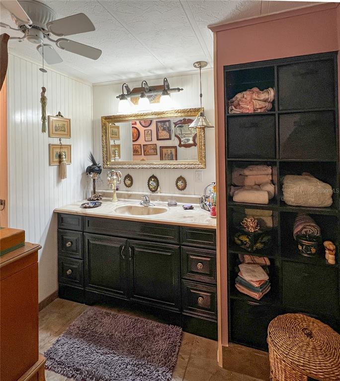 34543 Rosebud Row Zephyrhills, FL 33541 - Photo 21 of 41 a bathroom with a sink a toilet and shower