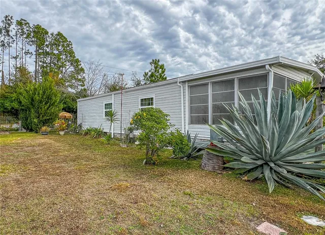 a view of a backyard with plants