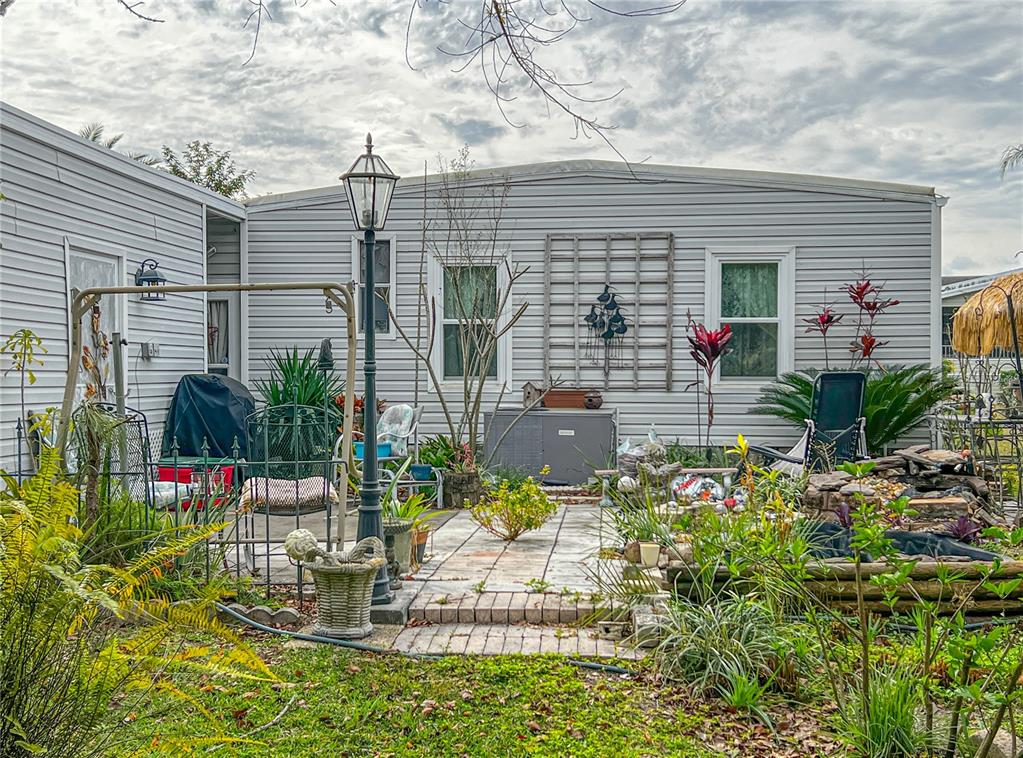34543 Rosebud Row Zephyrhills, FL 33541 - Photo 36 of 41 a front view of house with yard
