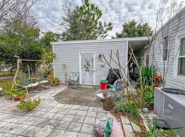 a view of a chair and table in the house