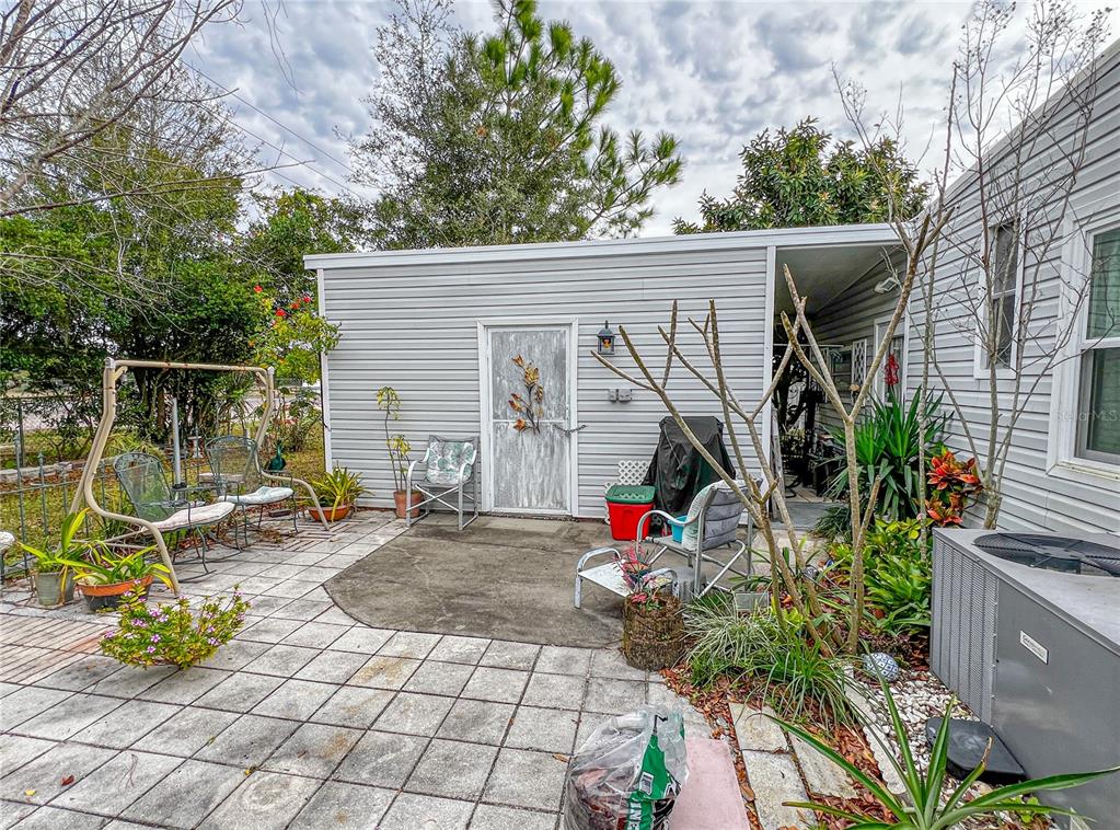 34543 Rosebud Row Zephyrhills, FL 33541 - Photo 39 of 41 a view of a chair and table in the house