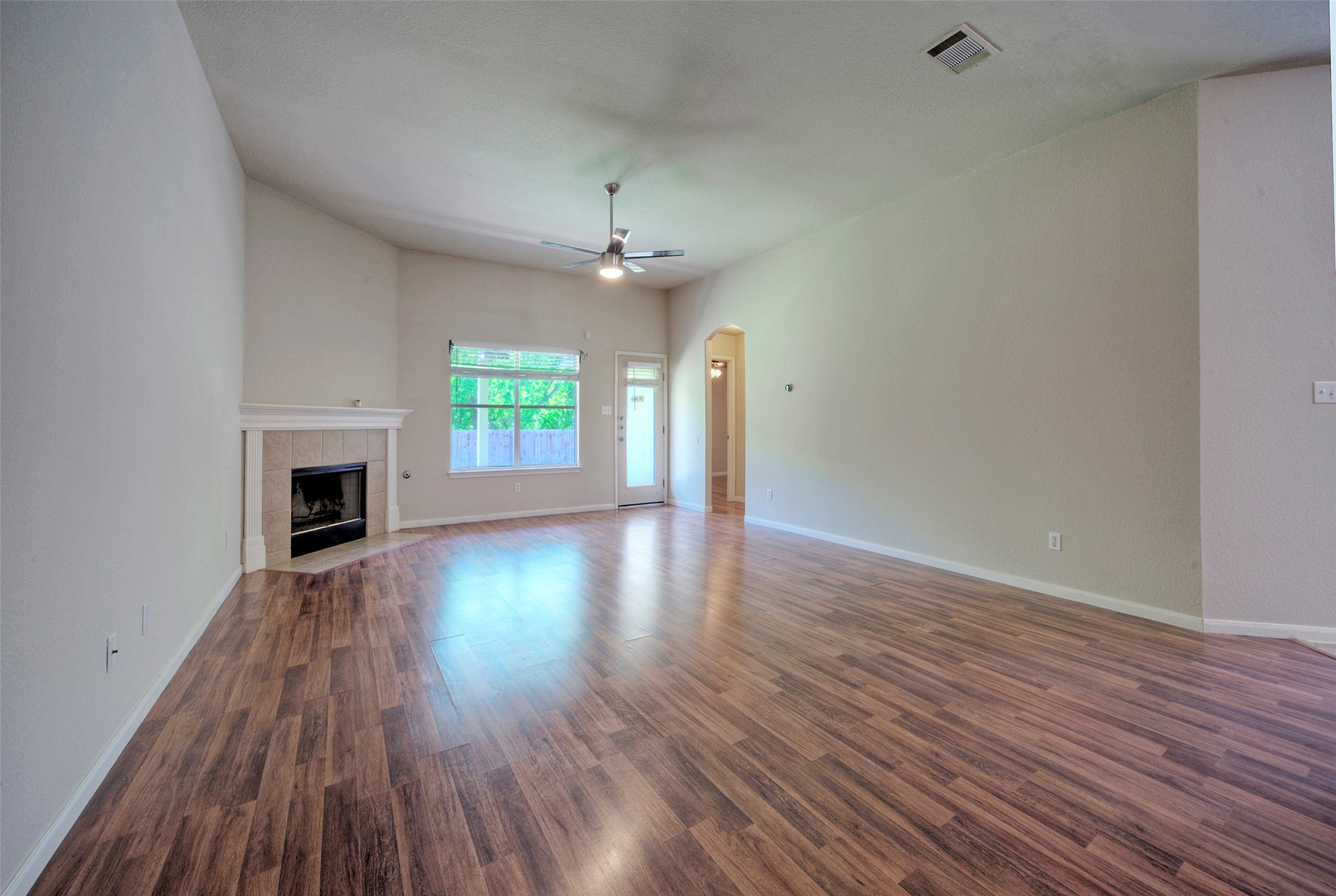 400 Pheasant Ridge Drive Round Rock, TX 78665 - Photo 12 of 29 Expansive living area featuring wood-finish flooring and vaulted ceilings